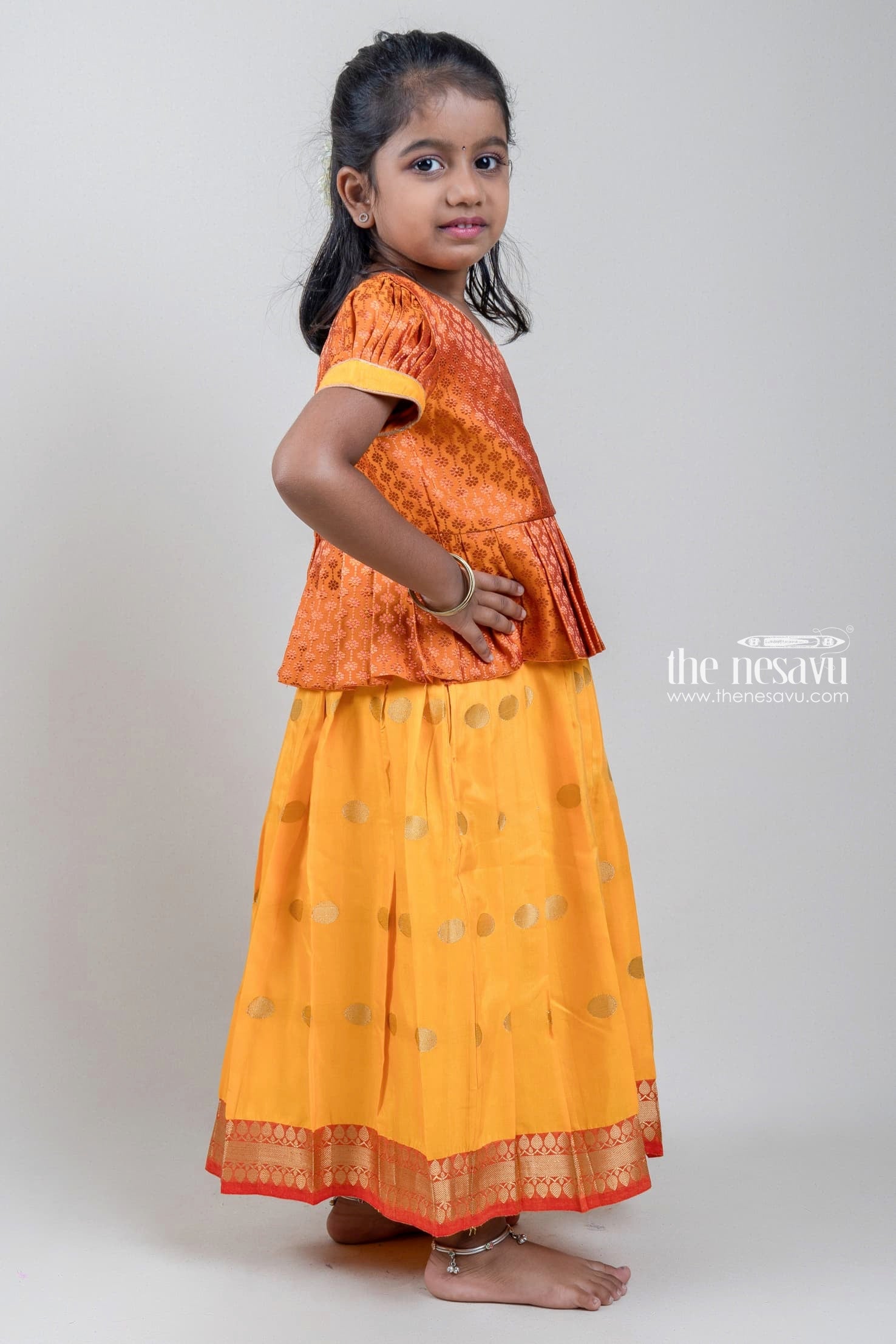 BANJUL, GAMBIA - MAR 14, 2013: Unidentified Gambian little girl in a shirt  and yellow skirt poses in the street in Gambia, Mar 14, 2013. Major ethnic  Stock Photo - Alamy